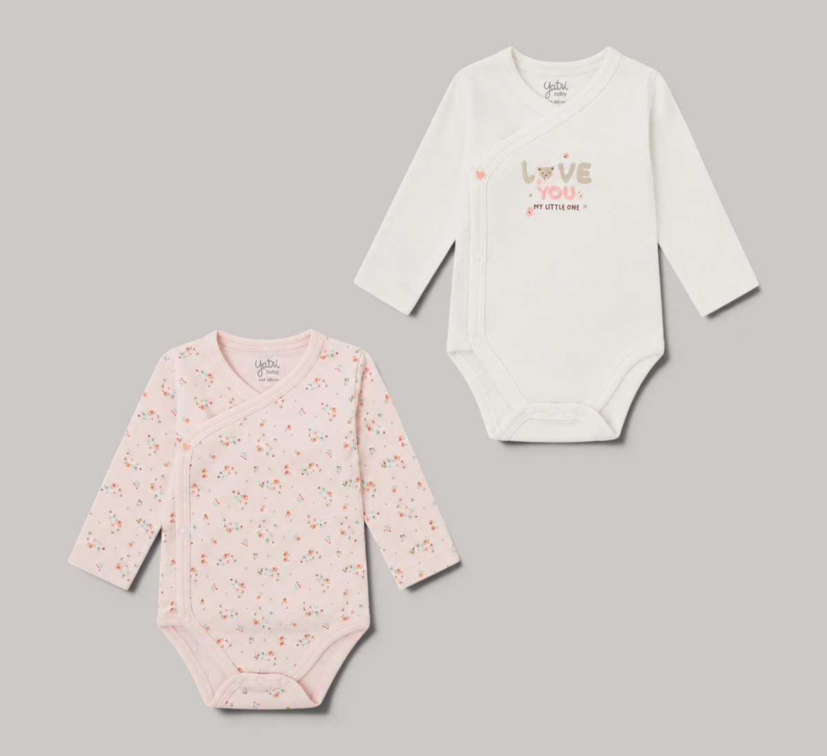 Pack de 2 bodies para bebé NAVIA, uno rosa con estampado floral y otro blanco con mensaje Love You, manga larga.
