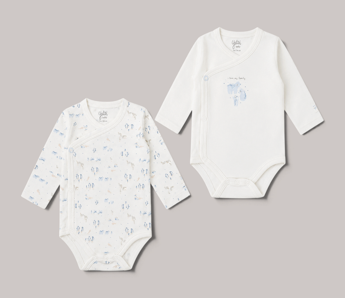 Pack de 2 bodies de manga larga NAVIA para bebé, color blanco con estampado de elefantes y diseño cruzado suave.