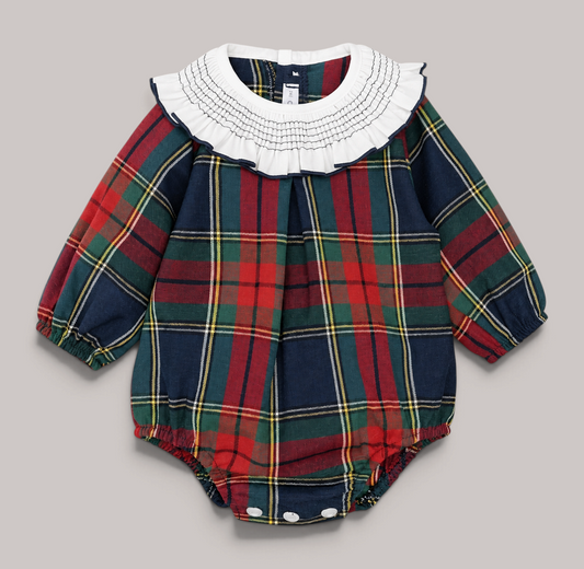 Pelele de bebé NAVIA con estampado de cuadros escoceses, cuello blanco con nido de abeja y mangas largas abullonadas.