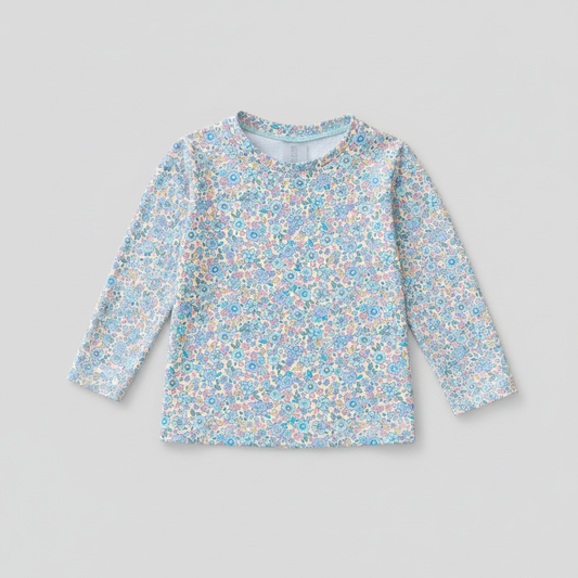 Camiseta de baño infantil floral azul de manga larga unisex sobre fondo gris perla