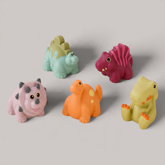 Juguetes de baño dinosaurios sensoriales set 5 piezas Kiokids sobre fondo gris perla