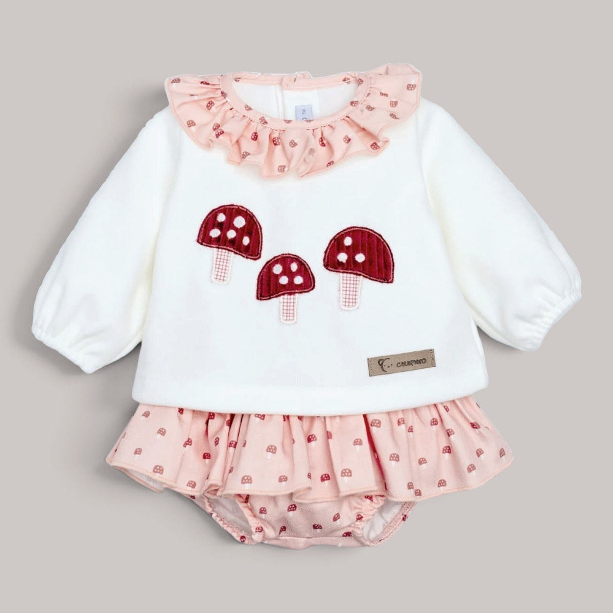 Conjunto NAVIA Calamaro con jersey blanco de setas y pololo rosa estampado para bebé