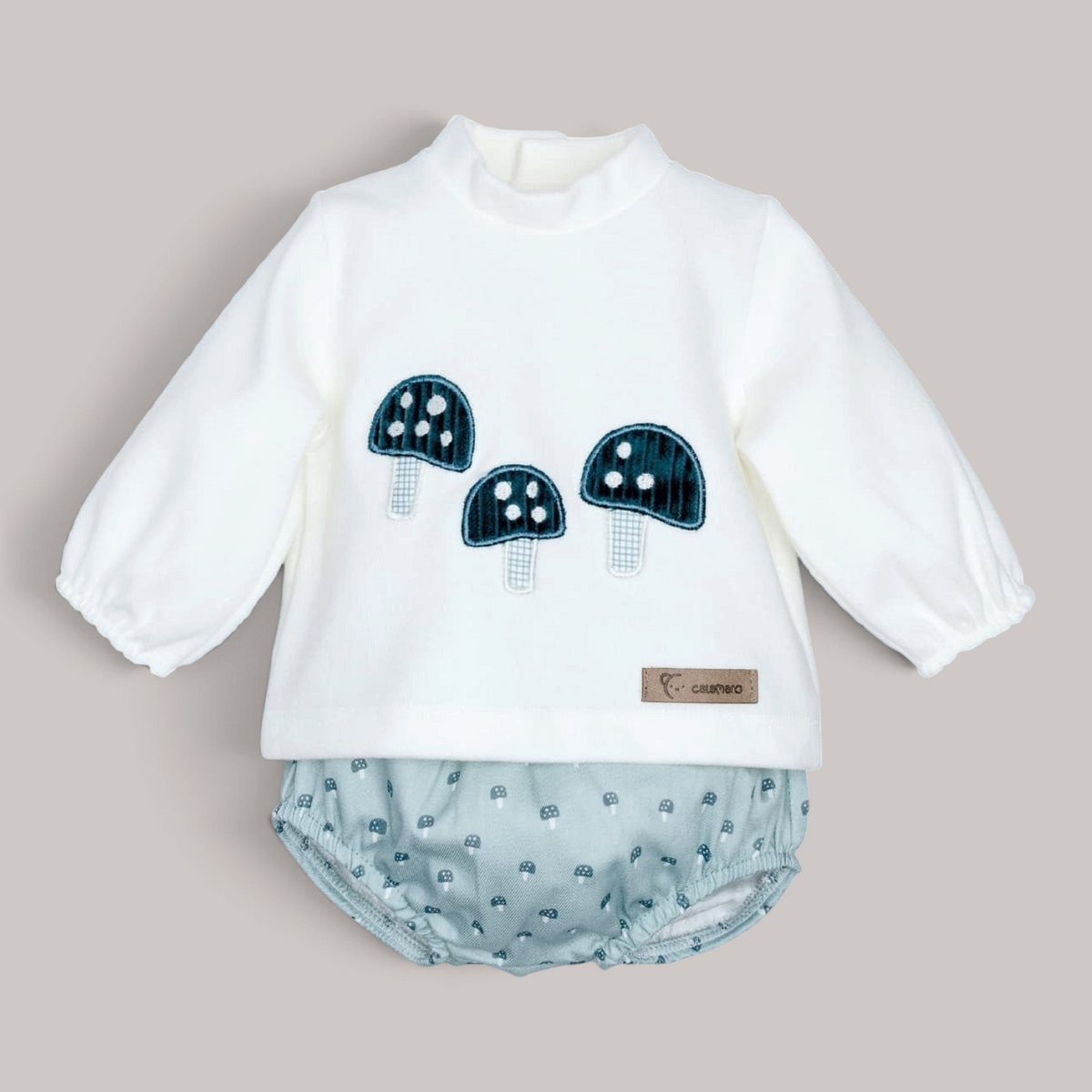 Conjunto NAVIA de jersey blanco con setas y pololo verde agua estampado para bebé
