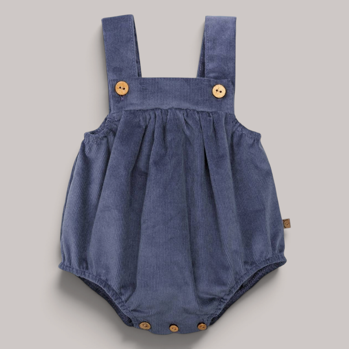 Peto Pampero de pana azul de NAVIA con tirantes y botones de madera para bebé